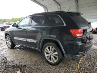 2012 Jeep Grand Cherokee Laredo with VIN 1C4RJEAG1CC316703, listed as a Copart auction lot 52128105 with 203,896 mi miles and Salvage Title. Bid and sale history available at carsss.com. Image 2.
