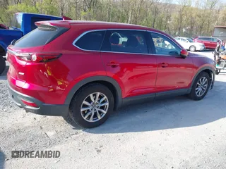 2019 Mazda CX-9 Touring with VIN JM3TCACY0K0310851, listed as a IAAI auction lot 42066395 with 91,046 mi miles and . Bid and sale history available at DreamBid. Image 4.