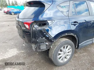 2015 Mazda CX-5 Touring with VIN JM3KE4CY5F0453646, listed as a IAAI auction lot 41740574 with 91,167 mi miles. Bid and sale history available at carsss.com. Image 18.