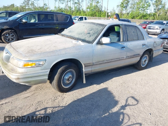 1997 Mercury Grand Marquis GS z VIN 2MELM74W6VX625065, wystawiony jako IAAI lot #42055672 z przebiegiem 125 494 mil mil oraz . Historia ofert i sprzedaży dostępna na DreamBid. Obrazek 2.