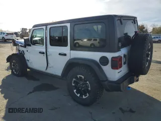 2024 Jeep Wrangler Rubicon with VIN 1C4RJXR6XRW115879, listed as a Copart auction lot 45816825 with 34,557 mi miles and Salvage Title. Bid and sale history available at DreamBid. Image 2.
