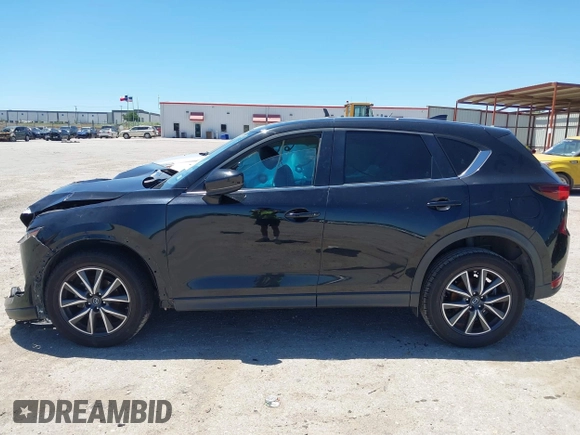 2018 Mazda CX-5 Touring z VIN JM3KFACM3J1339074, wystawiony jako IAAI lot #42317039 z przebiegiem 82 799 mil mil oraz . Historia ofert i sprzedaży dostępna na DreamBid. Obrazek 15.