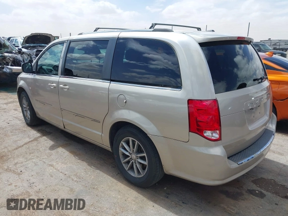2014 Dodge Grand Caravan SXT with VIN 2C4RDGCG6ER466459, listed as a IAAI auction lot 41820907 with 105,404 mi miles and . Bid and sale history available at DreamBid. Image 3.