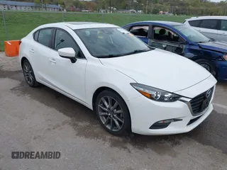 2018 Mazda 3 Touring with VIN 3MZBN1V32JM190611, listed as a IAAI auction lot 42032844 with 63,493 mi miles and . Bid and sale history available at DreamBid. Image 1.