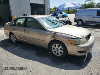 2002 Toyota Avalon XL z VIN 4T1BF28B72U261478, wystawiony jako Copart lot #57638745 z przebiegiem 146 479 mil mil oraz Szkody całkowita. Historia ofert i sprzedaży dostępna na DreamBid. Obrazek 4.