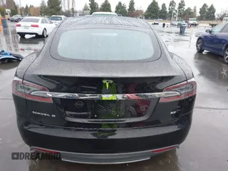 2013 Tesla Model S with VIN 5YJSA1CN0DFP20053, listed as a IAAI auction lot 41470660 with 61,568 mi miles and . Bid and sale history available at DreamBid. Image 17.