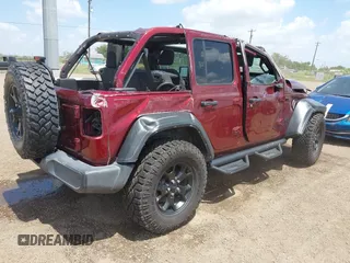2021 Jeep Wrangler Unlimited Sport S with VIN 1C4HJXDN0MW815350, listed as a IAAI auction lot 42416714 with 68,869 mi miles and . Bid and sale history available at DreamBid. Image 4.