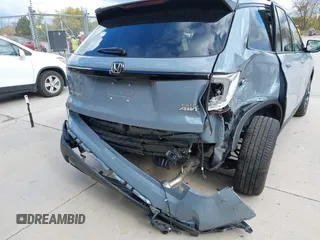 2023 Honda Passport Elite with VIN 5FNYF8H03PB000039, listed as a IAAI auction lot 40593339 with 33,697 mi miles and . Bid and sale history available at DreamBid. Image 6.