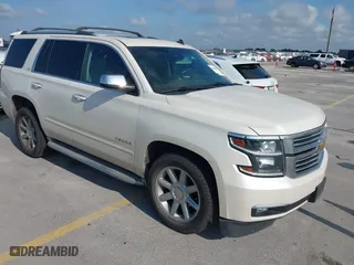 2015 Chevrolet Tahoe LTZ with VIN 1GNSCCKC4FR142856, listed as a IAAI auction lot 39886899 with 134,301 mi miles. Bid and sale history available at carsss.com. Image 1.