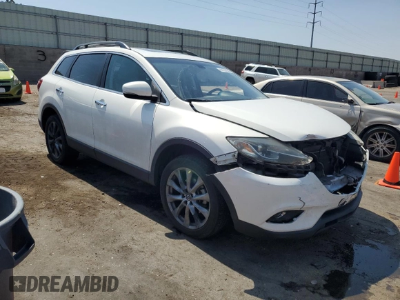 2015 Mazda CX-9 Grand Touring with VIN JM3TB3DA7F0454094, listed as a Copart auction lot 61757035 with 56,997 mi miles and Salvage title. Bid and sale history available at DreamBid. Image 4.