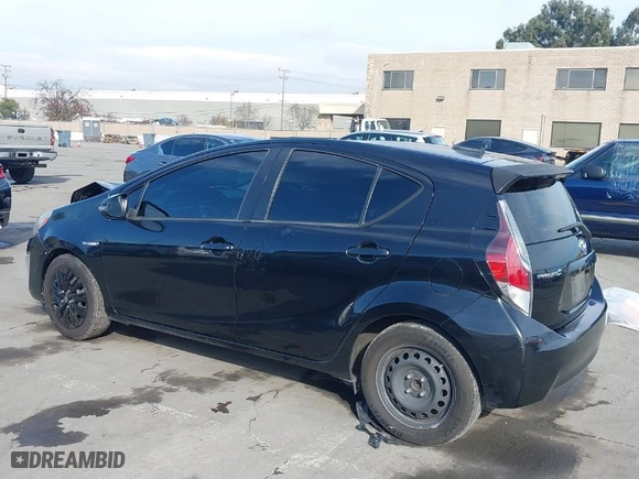 2015 Toyota Prius c One with VIN JTDKDTB3XF1585940, listed as a IAAI auction lot 41263863 with 267,841 mi miles. Bid and sale history available at carsss.com. Image 3.