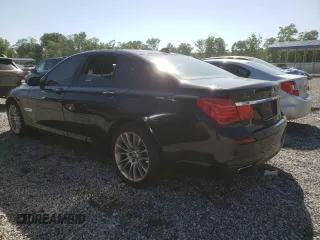 2012 BMW 7 Series 750i with VIN WBAKA8C59CDX01027, listed as a Copart auction lot 57881955 with 171,992 mi miles and Clean title. Bid and sale history available at DreamBid. Image 2.