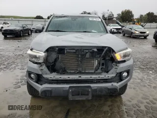2021 Toyota Tacoma 4WD SR5 with VIN 3TMDZ5BN5MM098717, listed as a Copart auction lot 43877975 with 21,328 mi miles and Salvage Title. Bid and sale history available at carsss.com. Image 5.