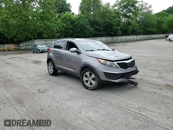 2012 Kia Sportage LX z VIN KNDPB3A20C7217165, wystawiony jako Copart lot #60999525 z przebiegiem 128 231 mil mil oraz Szkoda całkowita • Salvage title. Historia ofert i sprzedaży dostępna na DreamBid. Obrazek 14.