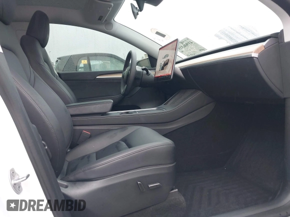 2023 Tesla Model Y Long Range with VIN 7SAYGDEE9PA094191, listed as a IAAI auction lot 41906319 with 15,240 mi miles and . Bid and sale history available at DreamBid. Image 5.