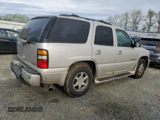 2005 GMC Yukon Denali z VIN 1GKEK63U65J262371, wystawiony jako Copart lot #52773425 z przebiegiem 129 028 mil mil oraz Czysty tytuł • Clean title. Historia ofert i sprzedaży dostępna na DreamBid. Obrazek 3.