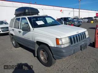 1996 Jeep Grand Cherokee Laredo with VIN 1J4GZ58Y5TC186403, listed as a IAAI auction lot 41562270 with 205,797 mi miles. Bid and sale history available at carsss.com. Image 1.