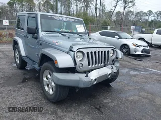 2014 Jeep Wrangler Altitude z VIN 1C4GJWBG0EL180241, wystawiony jako IAAI lot #41656723 z przebiegiem 104 390 mil mil oraz . Historia ofert i sprzedaży dostępna na DreamBid. Obrazek 1.