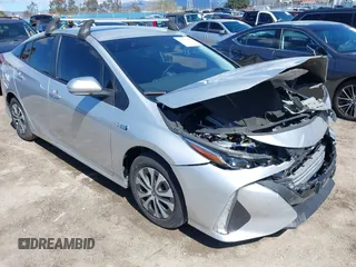 2021 Toyota Prius LE z VIN JTDKAMFP5M3179965, wystawiony jako IAAI lot #41755498 z przebiegiem 31 703 mil mil oraz . Historia ofert i sprzedaży dostępna na DreamBid. Obrazek 1.