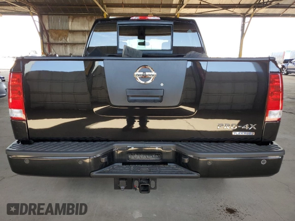 2011 Nissan Titan Pro-4X z VIN 1N6BA0EC9BN304469, wystawiony jako Copart lot #52982815 z przebiegiem 108 829 mil mil oraz Szkoda całkowita • Salvage title. Historia ofert i sprzedaży dostępna na DreamBid. Obrazek 6.