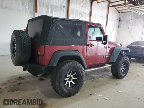 2012 Jeep Wrangler Sport with VIN 1C4AJWAG5CL233049, listed as a Copart auction lot 52328865 with 185,388 mi miles and Salvage title. Bid and sale history available at DreamBid. Image 3.