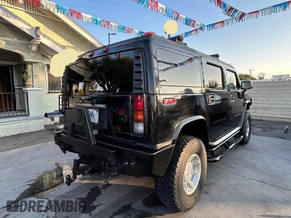 2003 Hummer H2 with VIN 5GRGN23U23H145183, listed as a Copart auction lot 84566884 with 85,945 mi miles and Clean Title. Bid and sale history available at carsss.com. Image 4.