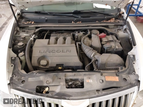 2012 Lincoln MKS with VIN 1LNHL9ER2CG803230, listed as a IAAI auction lot 41734620 with 66,585 mi miles. Bid and sale history available at carsss.com. Image 10.