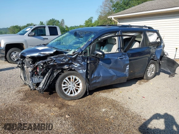2014 Toyota Sienna XLE with VIN 5TDYK3DCXES524294, listed as a IAAI auction lot 42546467 with 122,257 mi miles and . Bid and sale history available at DreamBid. Image 2.