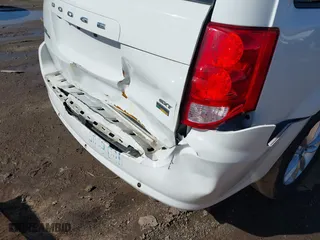 2016 Dodge Grand Caravan SXT with VIN 2C4RDGCG2GR390001, listed as a IAAI auction lot 41943622 with 127,328 mi miles. Bid and sale history available at carsss.com. Image 6.
