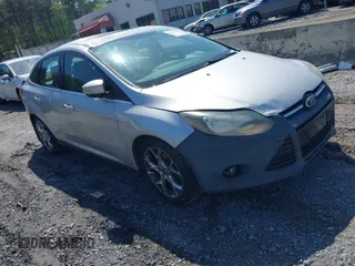 2014 Ford Focus Titanium with VIN 1FADP3J27EL227261, listed as a IAAI auction lot 41972536 with 172,470 mi miles. Bid and sale history available at carsss.com. Image 1.
