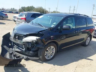 2014 Toyota Sienna XLE with VIN 5TDYK3DC2ES492554, listed as a IAAI auction lot 41685109 with 196,619 mi miles and . Bid and sale history available at DreamBid. Image 2.