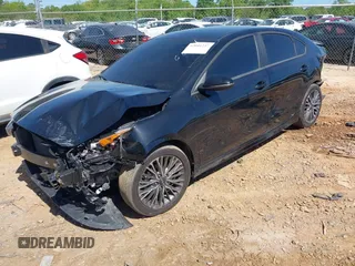 2023 Kia Forte GT-Line z VIN 3KPF54AD2PE685043, wystawiony jako IAAI lot #42041237 z przebiegiem 25 750 mil mil oraz . Historia ofert i sprzedaży dostępna na DreamBid. Obrazek 2.