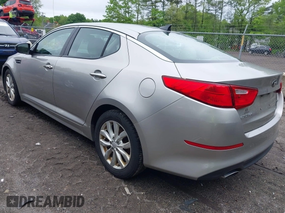 2014 Kia Optima EX z VIN 5XXGN4A70EG335090, wystawiony jako IAAI lot #42272655 z przebiegiem 165 795 mil mil oraz . Historia ofert i sprzedaży dostępna na DreamBid. Obrazek 3.