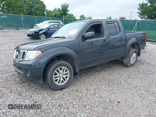 2015 Nissan Frontier SL with VIN 1N6AD0EV1FN764719, listed as a IAAI auction lot 42512771 with 104,572 mi miles and . Bid and sale history available at DreamBid. Image 18.