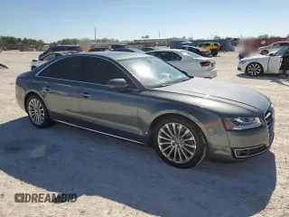 2015 Audi A8 with VIN WAUJGAFD5FN009026, listed as a Copart auction lot 81938904 with 122,880 mi miles and Salvage title. Bid and sale history available at DreamBid. Image 4.