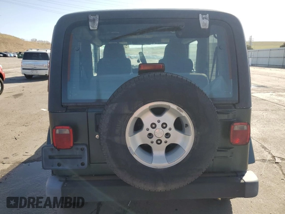 2003 Jeep Wrangler Sahara z VIN 1J4FA59SX3P302622, wystawiony jako Copart lot #52756105 z przebiegiem 181 900 mil mil oraz Szkoda całkowita • Salvage title. Historia ofert i sprzedaży dostępna na DreamBid. Obrazek 6.