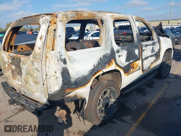 2014 Chevrolet Tahoe LT with VIN 1GNSCBE00ER247632, listed as a IAAI auction lot 41051307 with Not provided miles and . Bid and sale history available at DreamBid. Image 4.
