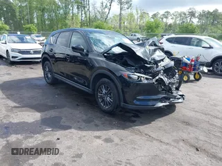 2019 Mazda CX-5 Touring with VIN JM3KFACM6K0672294, listed as a IAAI auction lot 42003210 with 50,127 mi miles. Bid and sale history available at carsss.com. Image 1.