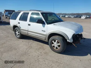 2001 Oldsmobile Bravada z VIN 1GHDT13W512107415, wystawiony jako IAAI lot #41678324 z przebiegiem 256 968 mil mil oraz . Historia ofert i sprzedaży dostępna na DreamBid. Obrazek 1.