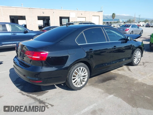 2015 Volkswagen Jetta Sedan 1.8T SE w/Connectivity with VIN 3VWD07AJ6FM354397, listed as a IAAI auction lot 41772983 with 100,265 mi miles. Bid and sale history available at carsss.com. Image 4.