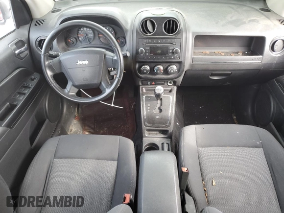 2010 Jeep Compass Sport with VIN 1J4NF4FB2AD525117, listed as a Copart auction lot 79426624 with 149,152 mi miles and Salvage Title. Bid and sale history available at carsss.com. Image 8.