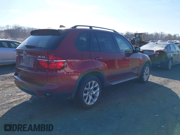 2011 BMW X5 35i with VIN 5UXZV4C52BL413125, listed as a IAAI auction lot 41697824 with 136,828 mi miles. Bid and sale history available at carsss.com. Image 4.