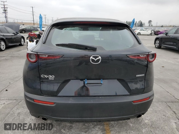 2025 Mazda CX-30 S with VIN 3MVDMBAMXSM778811, listed as a Copart auction lot 54241865 with 8,822 mi miles and Salvage title. Bid and sale history available at DreamBid. Image 6.