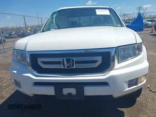 2009 Honda Ridgeline RTL with VIN 5FPYK16529B107871, listed as a IAAI auction lot 42049833 with 141,214 mi miles. Bid and sale history available at carsss.com. Image 13.