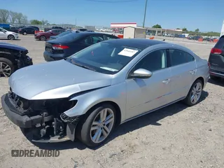 2014 Volkswagen CC Lux with VIN WVWRP7AN9EE504627, listed as a IAAI auction lot 42044187 with 114,153 mi miles and . Bid and sale history available at DreamBid. Image 2.