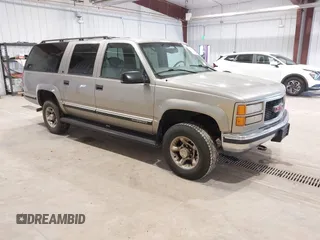 1999 GMC Suburban with VIN 3GKGK26J0XG537434, listed as a IAAI auction lot 41787267 with 180,439 mi miles. Bid and sale history available at carsss.com. Image 1.