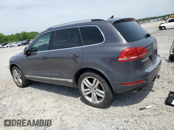 2013 Volkswagen Touareg Lux with VIN WVGEF9BP8DD002947, listed as a Copart auction lot 52590164 with 144,831 mi miles and Salvage Title. Bid and sale history available at DreamBid. Image 2.
