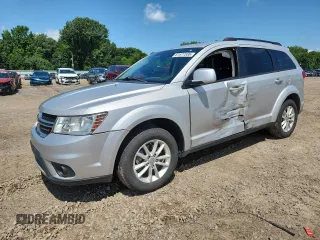 2013 Dodge Journey SXT with VIN 3C4PDCBG5DT500498, listed as a Copart auction lot 61677335 with 196,463 mi miles and Salvage title. Bid and sale history available at DreamBid. Image 1.