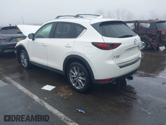2020 Mazda CX-5 Grand Touring with VIN JM3KFBDMXL0785865, listed as a IAAI auction lot 41567177 with 64,519 mi miles. Bid and sale history available at carsss.com. Image 3.