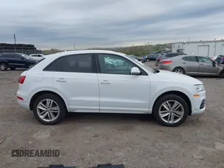 2017 Audi Q3 Premium z VIN WA1ECCFS7HR007729, wystawiony jako IAAI lot #42066580 z przebiegiem 116 460 mil mil oraz . Historia ofert i sprzedaży dostępna na DreamBid. Obrazek 13.